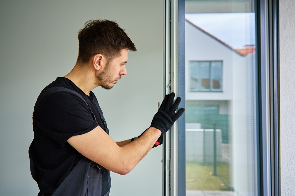 A specialist installing a European window in a modern home